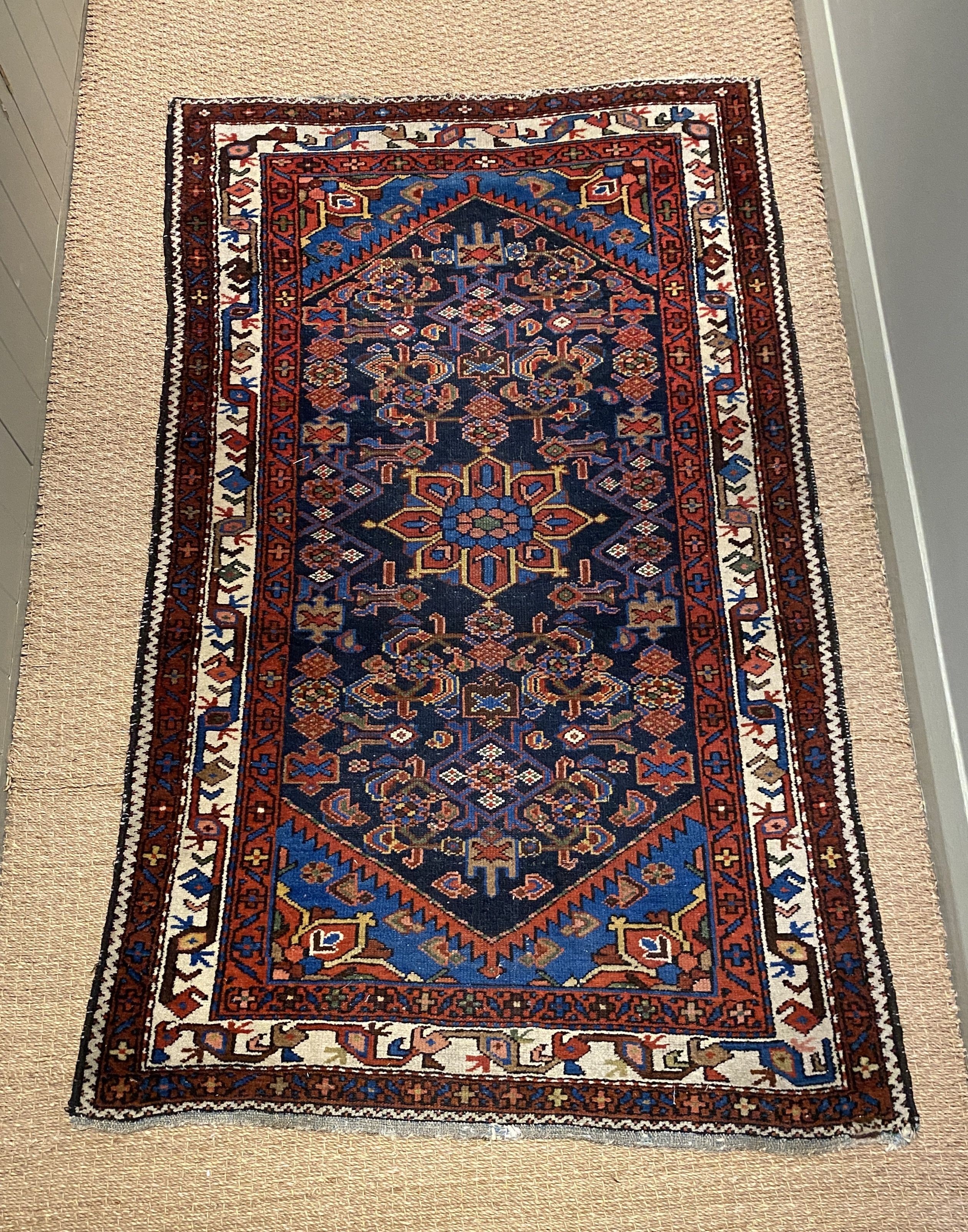 A Caucasian blue ground rug, triple bordered, 157 x 97cm